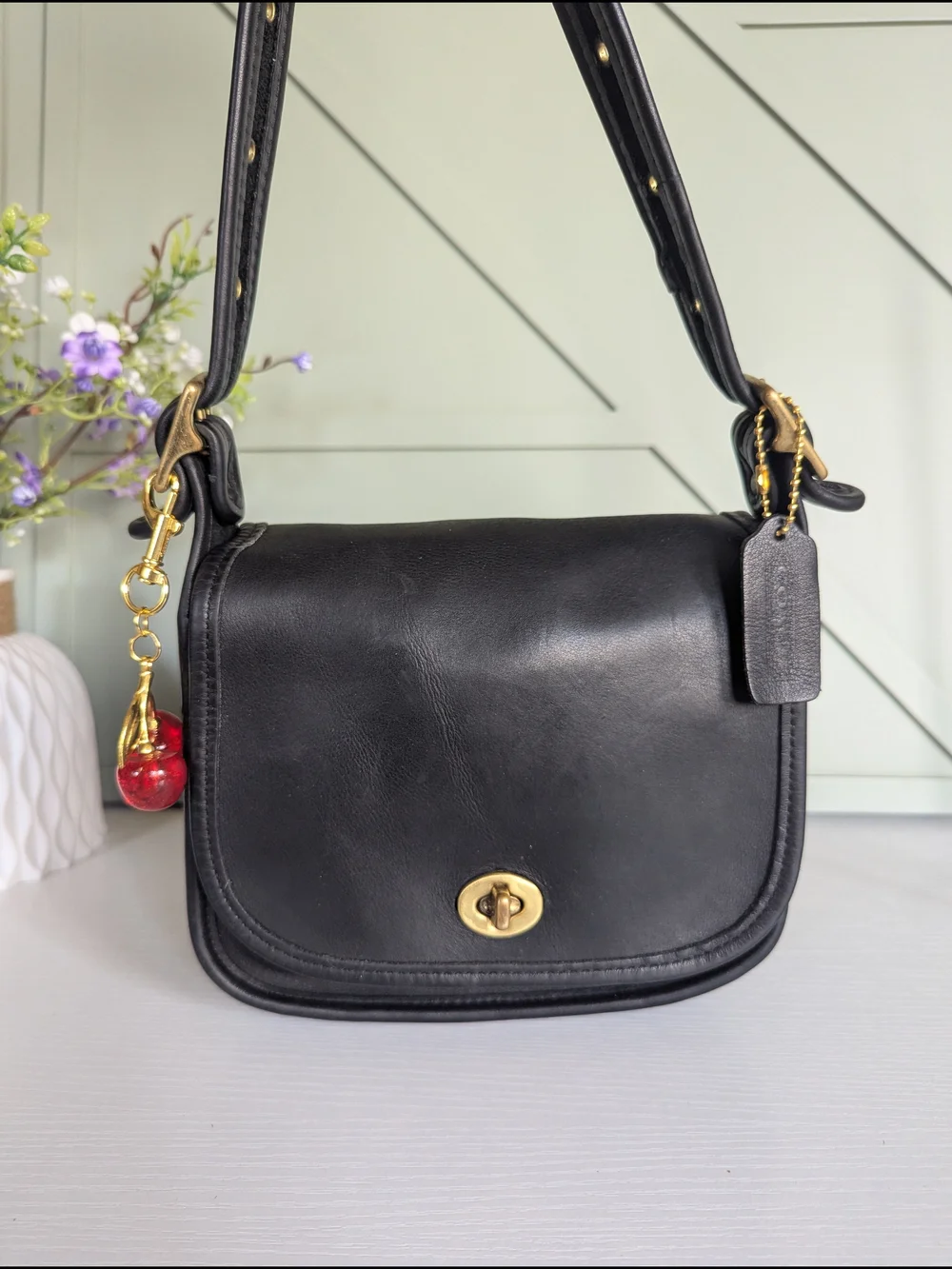 Coach Black Leather Crossbody with Gold Hardware and Cherry Charm